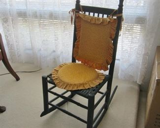 Very old rocking chair; not so great for sitting, nice for display