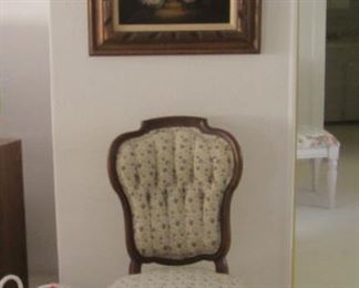 Antique chair got moved under the painting