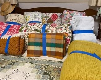 Assorted Linens that Include Bedspreads