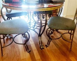 great glass top and iron base  4 chair table