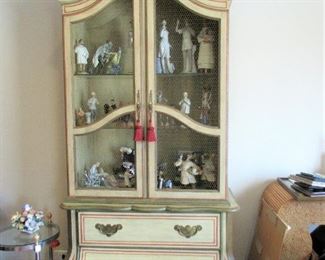 There is a pair of these incredibly fantastic curio cabinets.