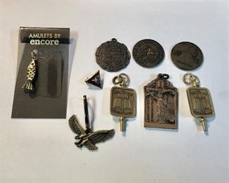 A small group of vintage emblems and a tiny YMCA lapel pin