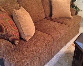 Three-cushion sofa; decorative pillows