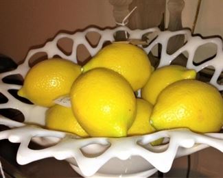 Milk glass filled with lemons