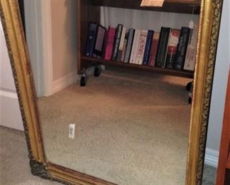Another gold framed mirror