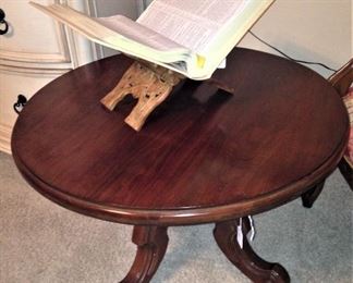Round coffee table ; carved book holder
