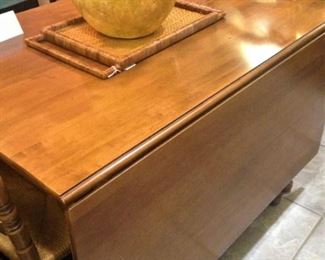 Drop leaf dining table easily seats 6 people.