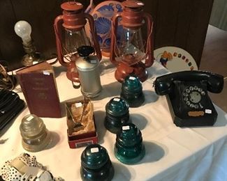 ANTIQUE rotary dial phone, insulators, and vintage lanterns