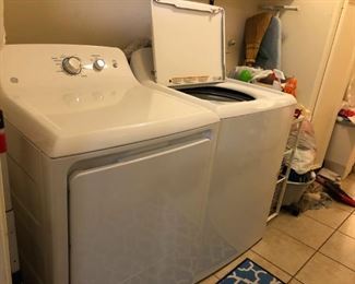 The same GE top-loading washer and front-loading dryer