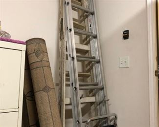 Just three of our many available ladders -- some still with tags, variety of sizes and step stools as well. 