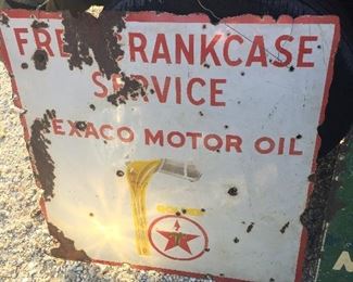 old Texaco signs with some bullet holes