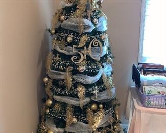 Lighted Christmas tree with gold decorations