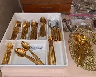 8 piece setting gold-ware plus serving pieces