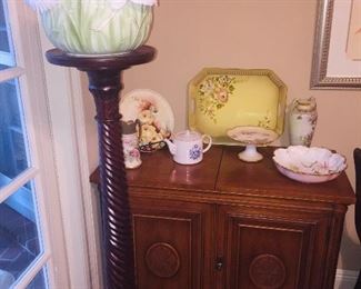 a Mid Century server, a tall fern stand and lots of fine porcelain