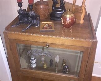 early Art Deco display dabinet with hand carved antelopes and bronze Monkey candle sticks
