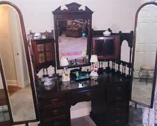 a 19th century Walnut Victorian dresser with attached mirrors