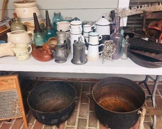 Cast iron large wash pots, enameled coffee pots, crocks, churns, oil bottles, cast iron cookware