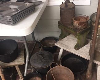 Lots of early cast iron cook pots perfect for fireplace cooking