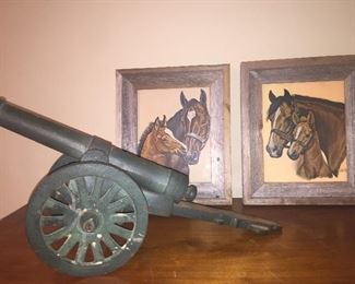 miniature cannon and two 1940's framed prints of horses