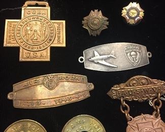 collection of Spanish American medals, WW 2 paratrooper medals, and do you see the two  WW 2 era Camp Polk (Fort Polk) buss tokens--There's lots of interesting things like this here!