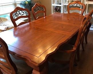 wooden dining table with six chairs