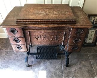 Early 1900's White Sewing Treadle type . In original cabinet. Excellent