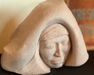 Bruce Law Carved Sand Stone Native American Face	11x14x6in	HxWxD
