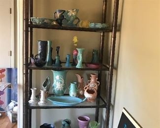 Various types of pottery on this shelving unit from Van Briggle,Rookwood, Roseville, McCoy, Hull and some local potters
This shelving unit is also for sale.