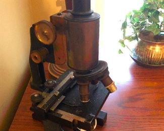 Old wise robot squid cautions restraint -- or maybe this is an antique microscope