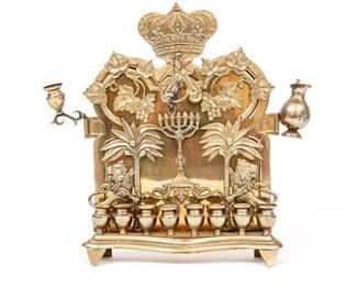 An Israeli Parcel Gilt Brass Bench Form Menorah