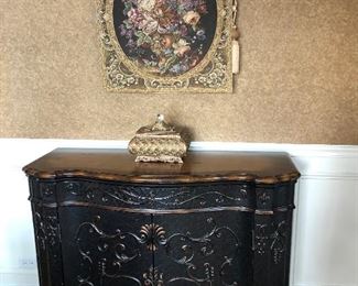 Black and wood cabinet , tapestry