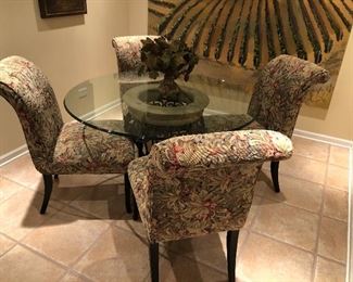 round glass table with iron tuscony base with 4 sleigh back chairs 48"