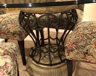 round glass table with iron tuscony base with 4 sleigh back chairs 48"