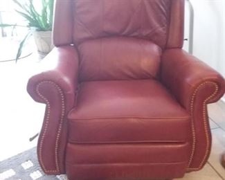 Leather rocker recliner with nail head trim