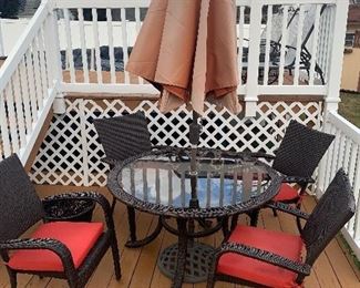 Beautiful wicker table w/chairs & cushions! Great condition 1 year old! 