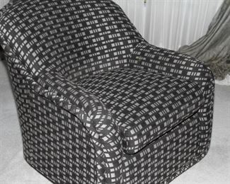 $365.00-Black & White Swivel Chair