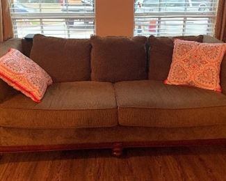 Upholstered sofa with wood trim