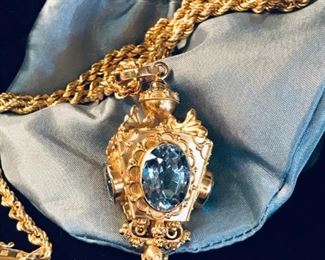 18kt gold Etruscan revival style fob pendant. 4 lab created blue green spinels. Pendant is 2" long. Chain is 18kt and 19" long.