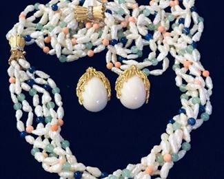 Seed pearl necklace with gold and diamond clasps, converts into necklace and bracelet. Coral earrings.