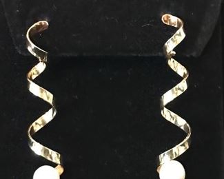 14kt gold and pearl earrings- these earrings have an almost undetectable hinge that allows them to move on your ear. 