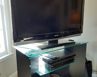 41 1/2" Large TV - 41 1/2" x 10" x 29"  - $                                                 TV Stand Black and Glass - 36" x 19" x 29 1/2"  - $                          