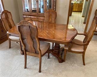Bernhardt dining set.  Comes with one captain’s chair, 5 side chairs, two leaves and full table pads 
