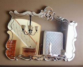 Impeccable antique Venetian beveled mirror. I bought this at an auction, had it repainted on sides and is in perfect shape. Not sure of age it it’s an oldie. One of a kind.