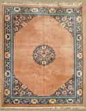 SALMON AND BLUE CHINESE CARPET. COIN DESIGN. GOOD. 9' X 12'.