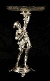 TALL SILVERED BRONZE CENTERBOWL. FIGURE OF A WOMAN SUPPORTS THE ETCHED GLASS BOWL. GOOD. 27 1/2" H X 15 1/4" DIA.