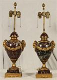 PR. OF BRONZE ROUGE MARBLE FRENCH URN /LAMPS. ROUGE MARBLE URNS WITH GILT ORMOLU RAM'S HEAD HANDLES AND FLORAL GARLAND DECORATION. GOOD. 18 1/2" H X 8 1/2" W.
