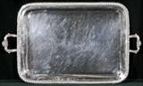 2 HANDLED SILVER PLATED TRAY. FLORAL HANDLES AND A GADROON BORDER. HANDLES REPAIRED. 29 3/4" W X 17 1/2" D.