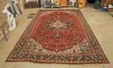 LG. INDO-HEREZ CARPET. GEOMETRIC FLORAL DESIGN. PEACH, BLUE, GREEN AND WHITE COLORATION. STAINED, WORN CENTER. ONE CORNER AS IS. AS IS. 14' 2" X 24'.