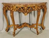 GILT CARVED ITALIAN CONSOLE WITH MARBLE TOP. SHAPED WITH OPEN WORKED FLORAL DESIGN. STANDING ON CABRILOE LEGS. GOOD. 36 1/2" H X 51" W X 15" D.