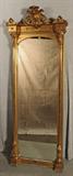 ANTIQUE FRENCH GILT PIER MIRROR. OPEN WORKED CARVED TOP. FLORAL DECORATED SIDES AND BASE. GOOD. 80" H X 31 1/4" W X 7" D.